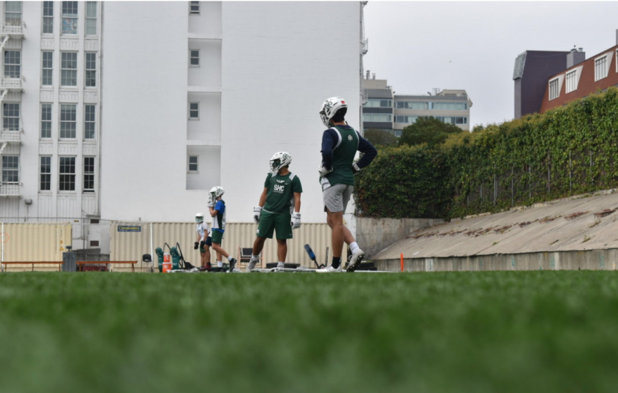 The Boys Lacrosse team runs through socially-distanced agility drills during pre-season exercises.