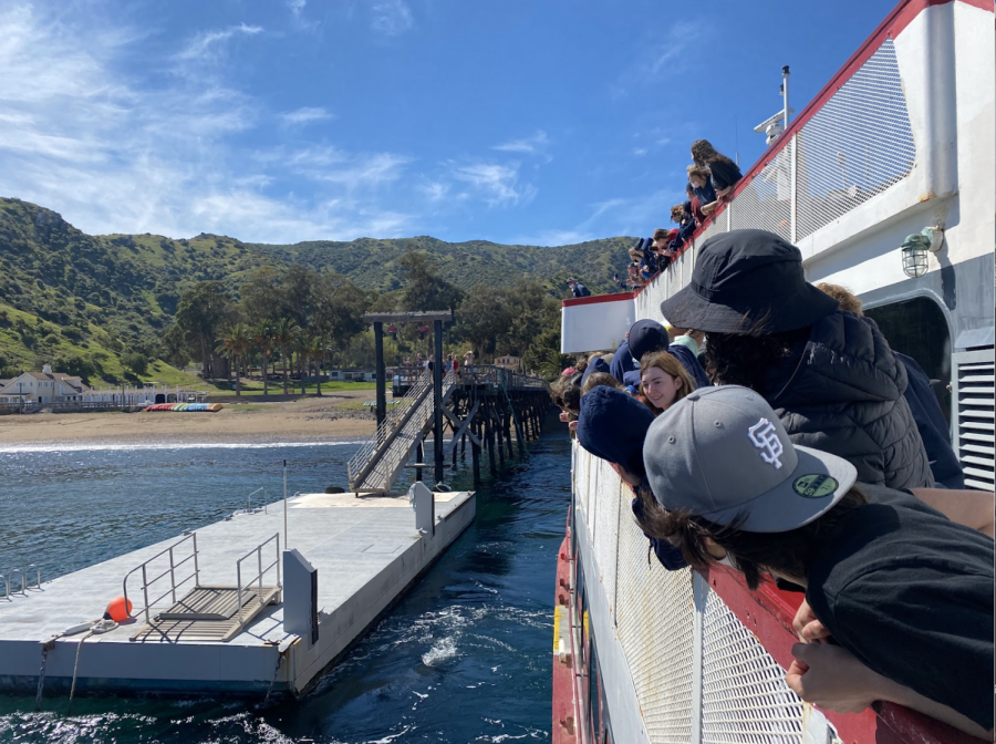 SHC students wave goodbye to their counselors from the ferry and watch each leader jump off the dock.