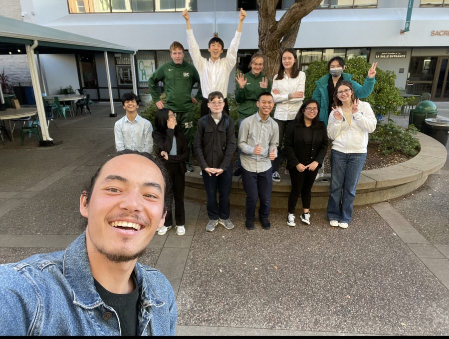 The Debate team poses for a group photo after an online tournament. 