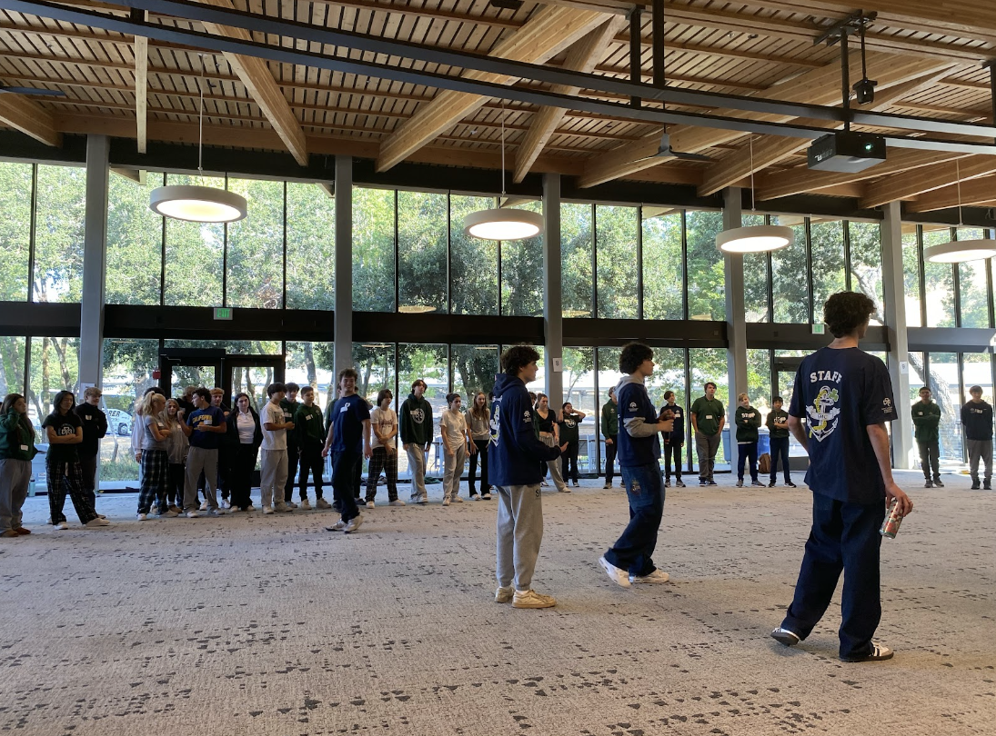 Frosh students play games with their student leaders at their freshman retreat.