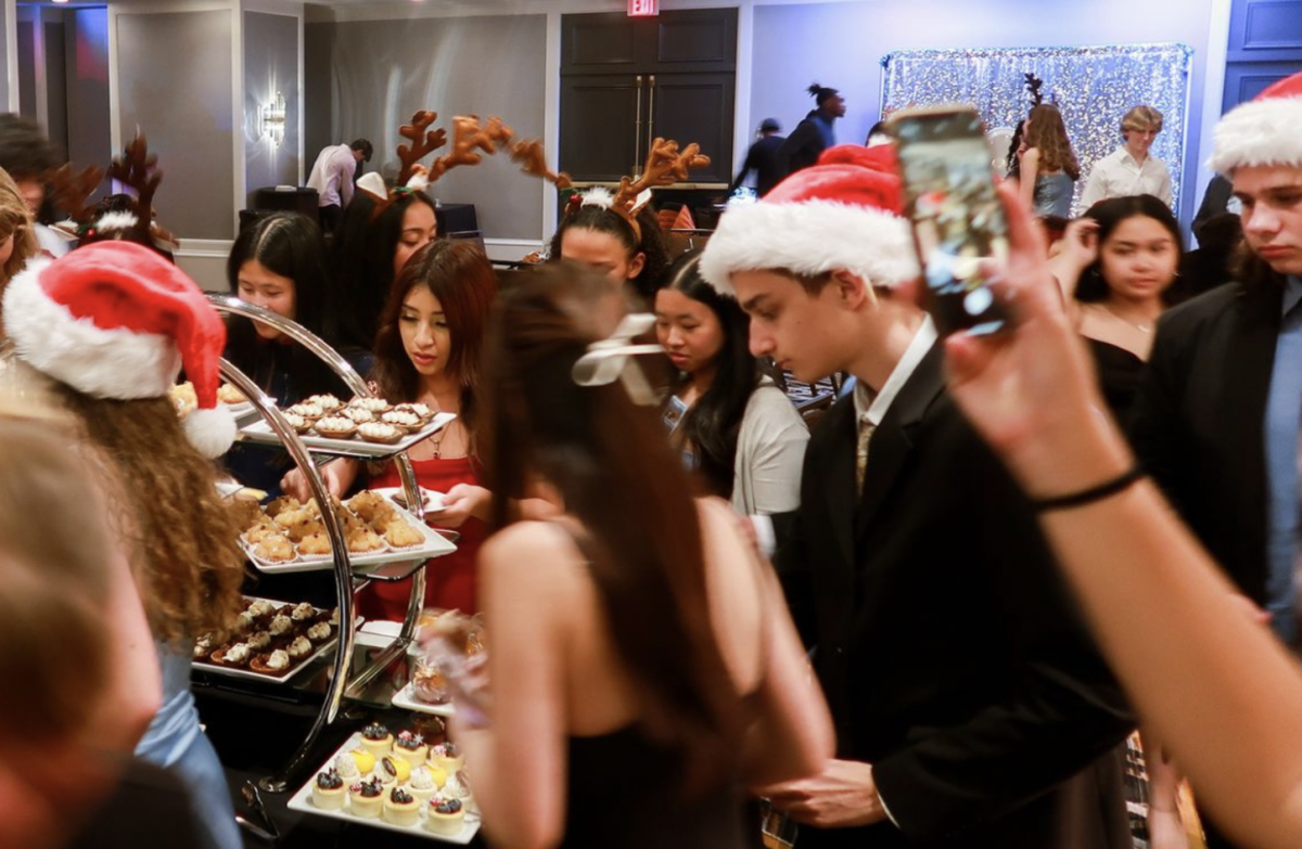 Students try the tasty snacks at the Snowball Winter Dance. 