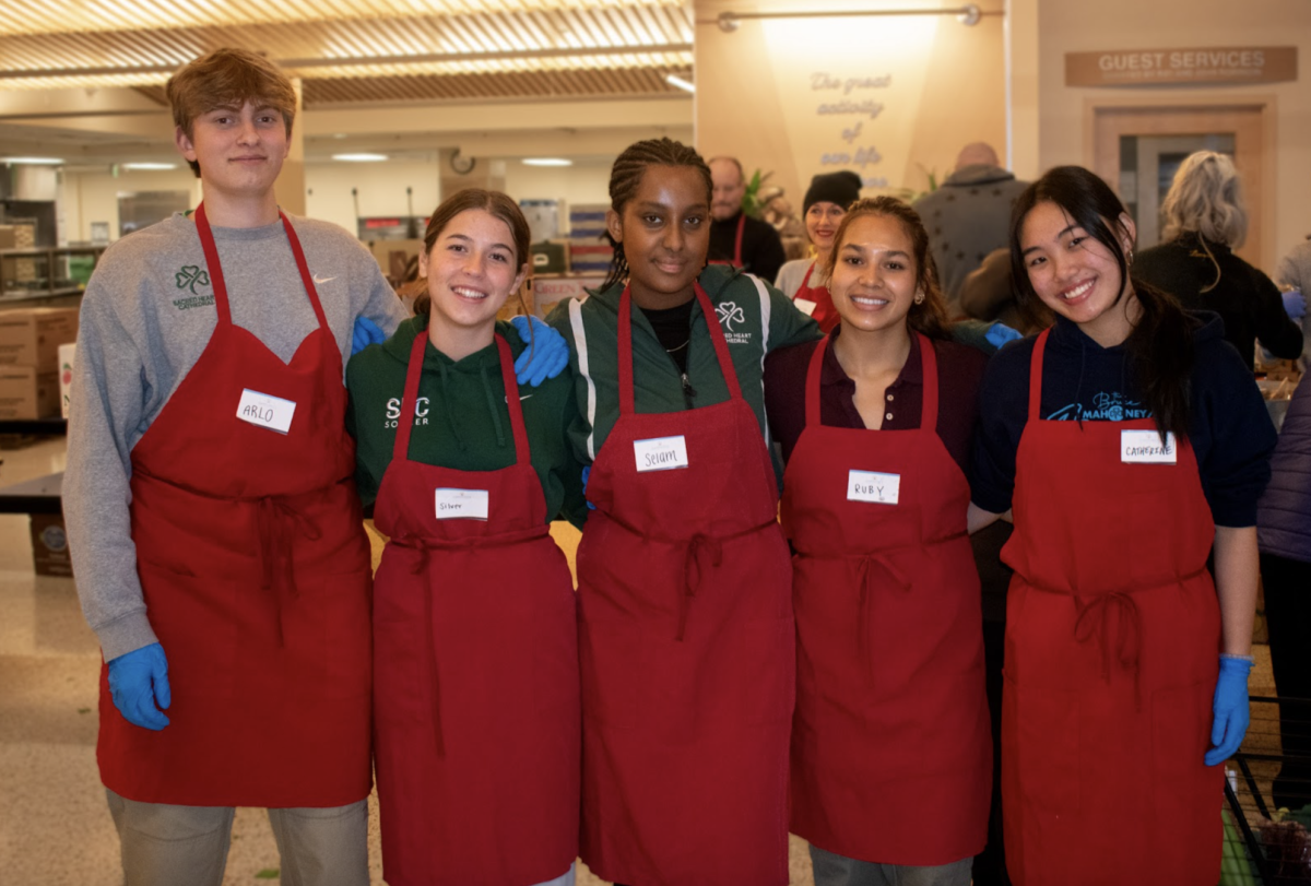 SHC students volunteering at St. Anthony’s Farmers Market. 