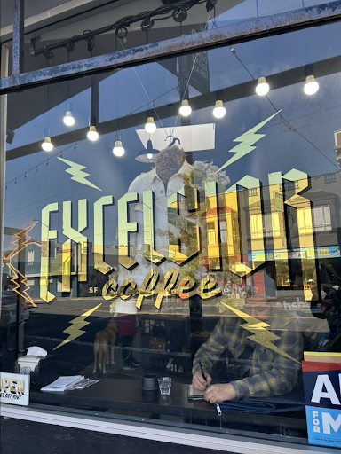The eye-catching and bright golden “Excelsior Coffee” sign.