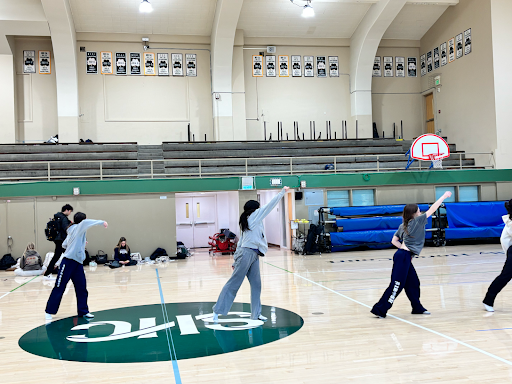SHC’s Advanced Dance class preparing one of their group routines in the Old Gym.