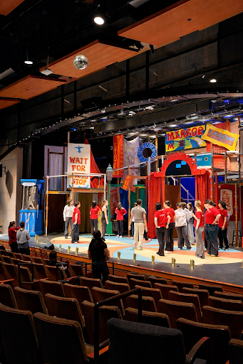 The cast and crew of Ride The Cyclone on the stage during a rehearsal. 