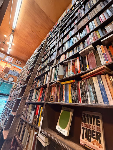 A shelf of a variety of books by female authors at Westbridge Rare Books in New York City, New York. 