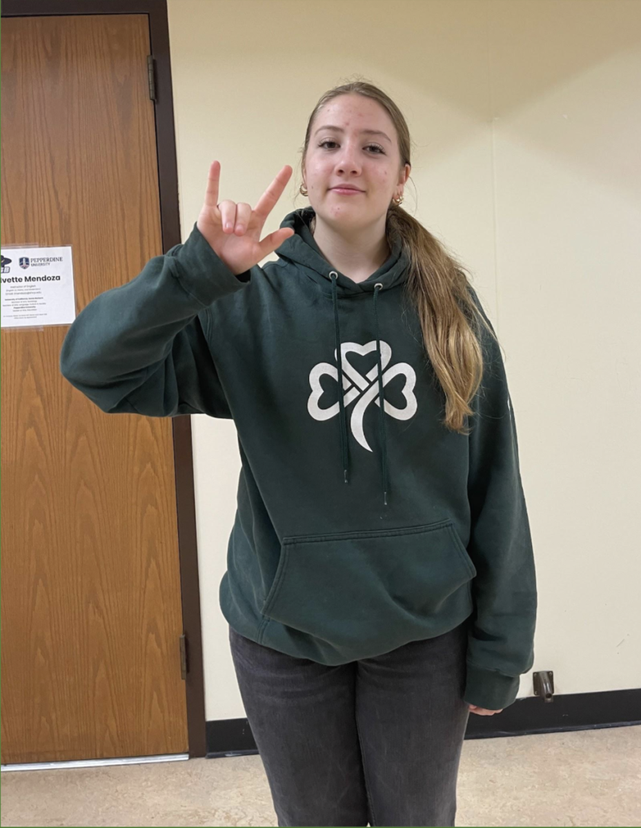 Bridget Mullen '28 signs "I love you" in ASL and LSPR. 