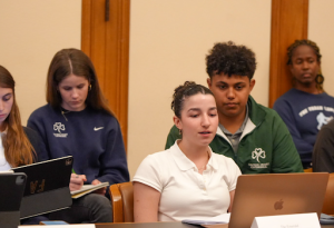 Siena Larkin ‘27 addresses a question on San Francisco safety to the panel participants.
